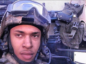 Jameel Evans in uniform and a helmet during his military service